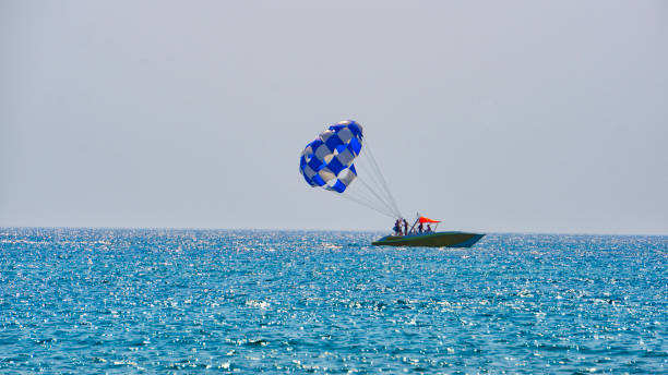 istock Parasailing, towing behind a man’s boat in a parachute system 1185006799