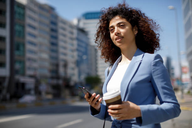 istock Young smiling businesswoman communting to work 1185007020