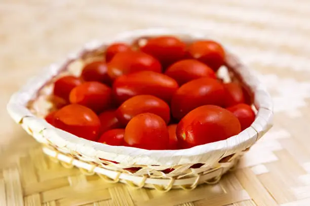 vertical photo red tomato cherry set vegetable bleached bright background