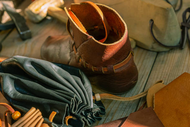 istock leather goods master reconstruction black wallet boots close-up tannery counter 1185007181