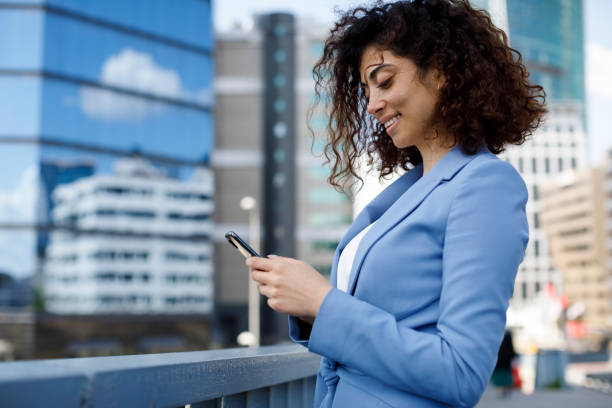 istock Young businesswoman using cellphone 1185007187