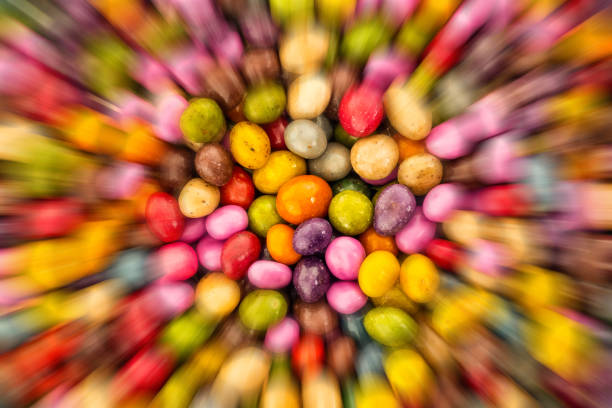 glazed candy dragee motion blur lines background base festive yellow green pink
