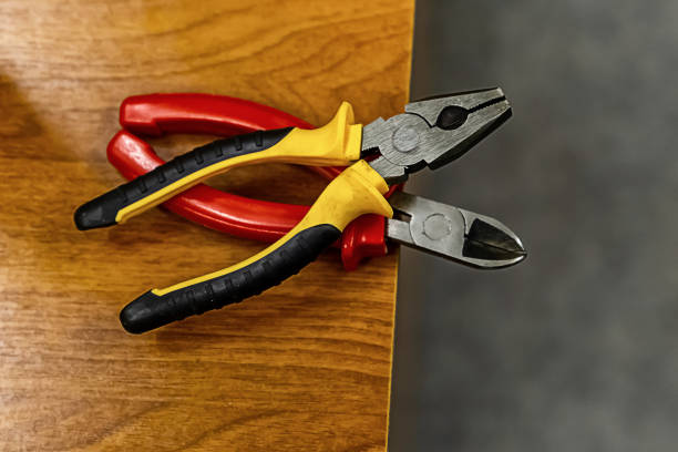 istock pair of pliers bright handles plastic yellow red working hand tools 1185011423