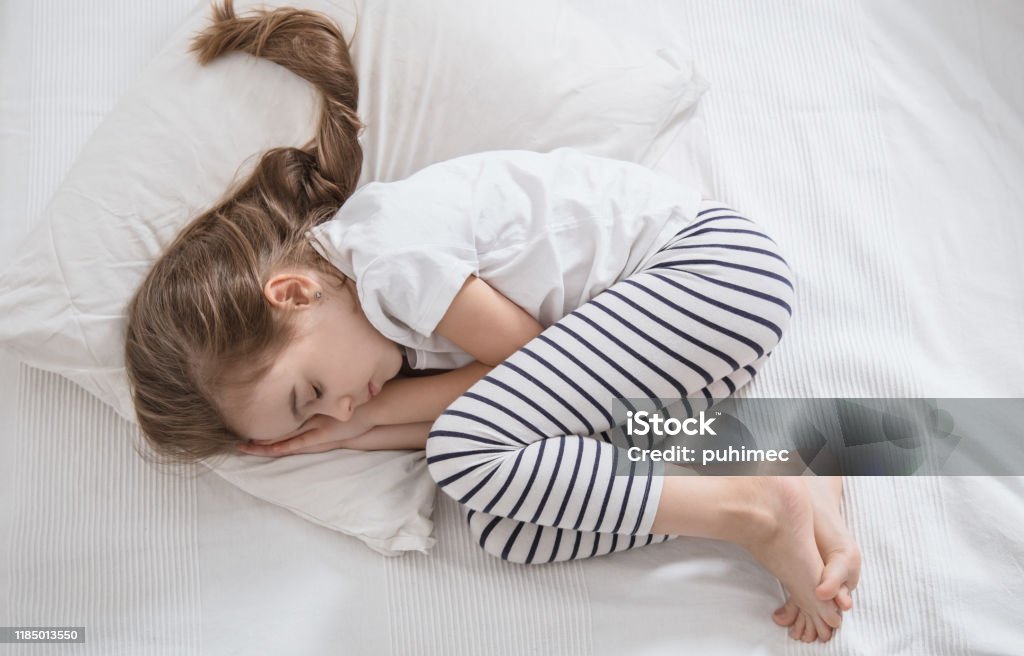 Cute Little Girl With Long Hair Sleeping In Bed Stock Photo - Download  Image Now - Beauty, Bed - Furniture, Bedroom - iStock
