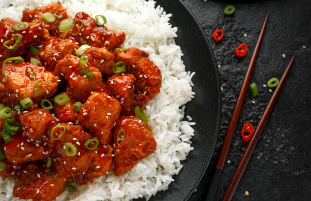 istock Tso's chicken with rice, green onion and broccoli 1185013576
