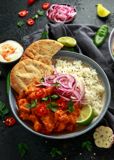 istock Meat free butternut squash curry with jasmine rice, pickled onions and naan bread 1185013925