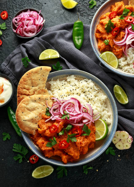 istock Meat free butternut squash curry with jasmine rice, pickled onions and naan bread 1185013927