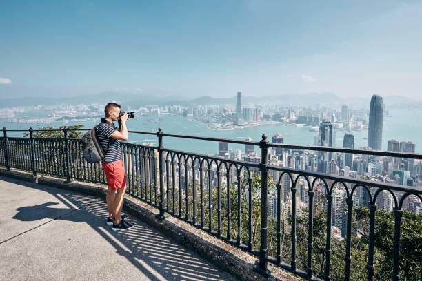 istock Traveler photographing urban skyline 1185014754
