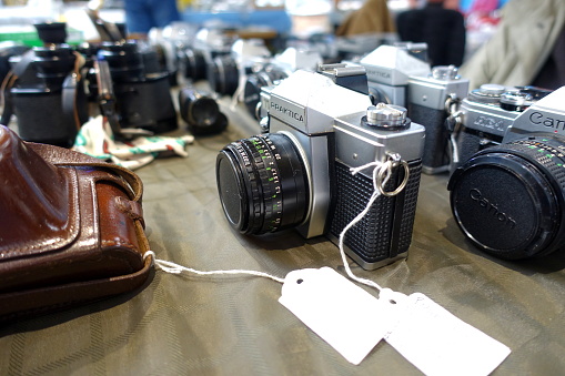 Plymouth England November 2019. Public market. Close up of Praktica vintage film camera on desk.