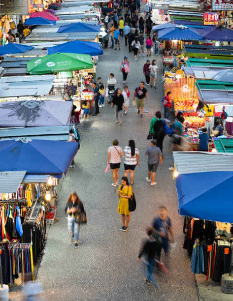 istock Woman using phone, motioned blurred market 1185015932