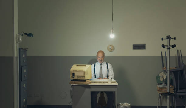 istock Sad businessman working in a small office 1185015950
