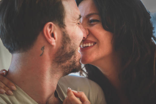 istock Cheerful couple about to kiss 1185016020