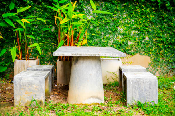 Tables and chairs are made of concrete in the garden for relaxation