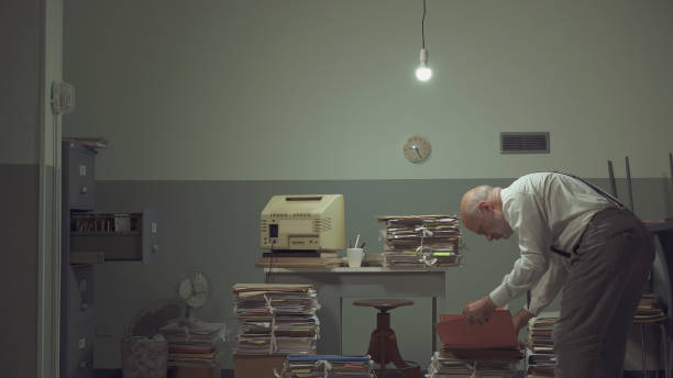 istock Businessman working in a messy office 1185016187