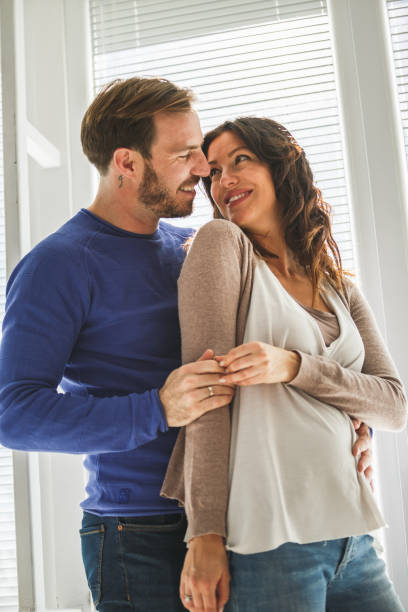 istock Romantic couple cuddling together 1185017377