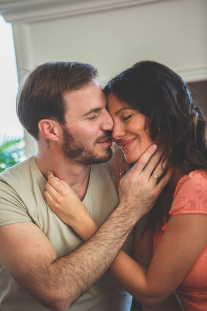 istock Happy couple caressing at home 1185017974