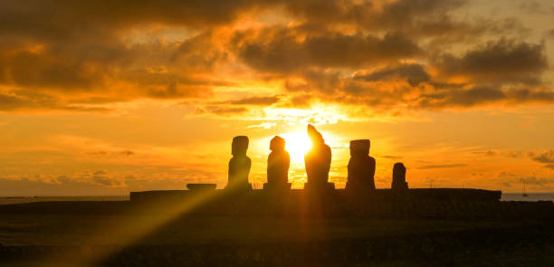 istock LENS FLARE: Golden sunset illuminates a row of moai statues on Easter Island. 1185018192