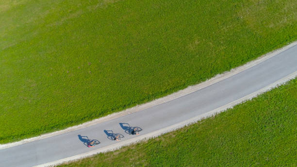 istock TOP DOWN: Active tourists exploring the picturesque countryside on bicycles. 1185019124