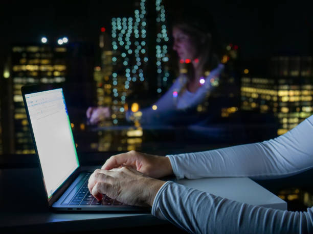 istock CLOSE UP: Unrecognizable woman's fingers typing on the laptop keyboard at night. 1185019340