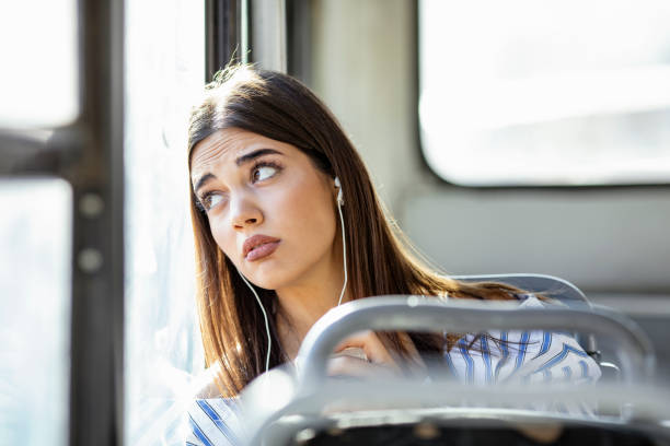 istock Sad young woman is traveling with a train 1185019471