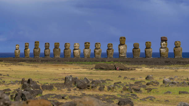 istock AERIAL: Flying across a dried up meadow and towards monolithic sculptures. 1185019707