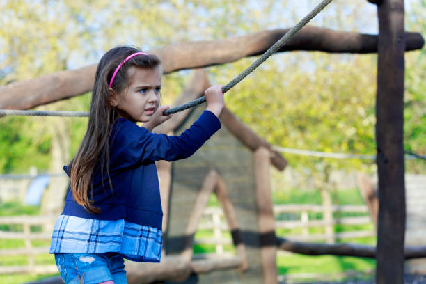istock Kids playing at the playground 1185022505