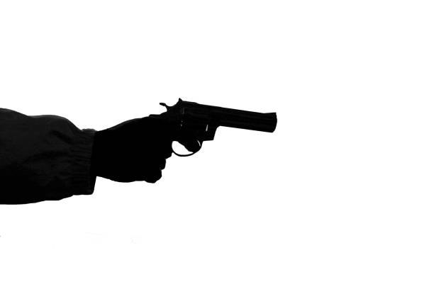 Man's hand holding revolver