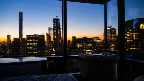 istock SILHOUETTE: Empty leather sofa chair faces the window offering a view 1185027715