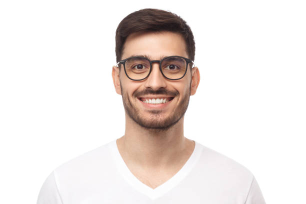 Smiling handsome young man in casual t-shirt, looking at camera, isolated on white background Smiling handsome young man in casual t-shirt, looking at camera, isolated on white background male likeness photos stock pictures, royalty-free photos & images