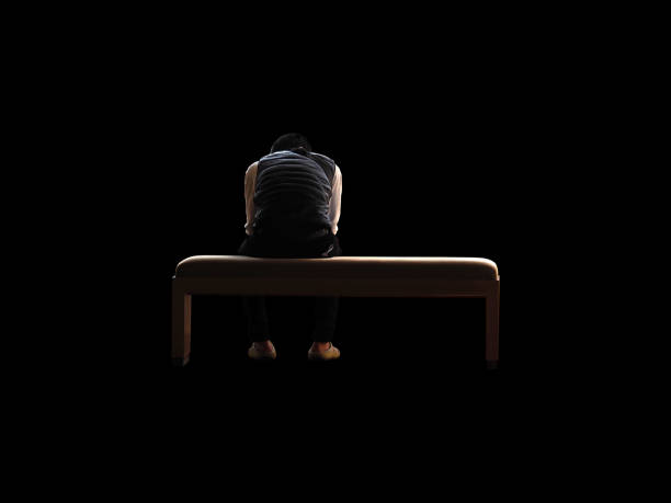 Sad man sitting on the floor