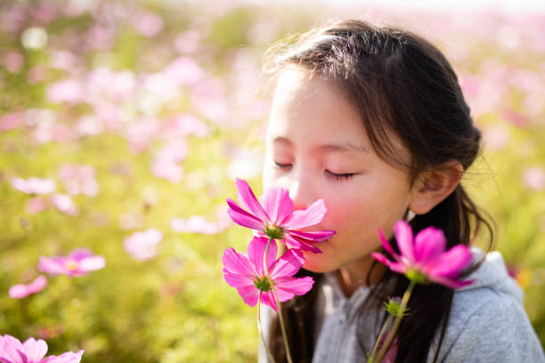 istock Girl playing in the cosmos field 1185032548