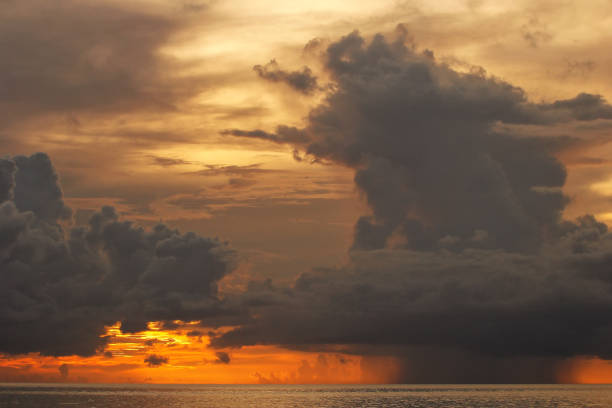 Colorful storm clouds with rain over Somosomo Strait on Taveuni Island, Fiji Colorful storm clouds with rain over Somosomo Strait on Taveuni Island, Fiji. Taveuni is the third largest island in Fiji. vanua levu island photos stock pictures, royalty-free photos & images