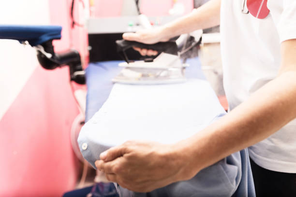 istock Ironing clothes in laundry room 1185034084