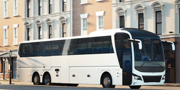 modern white realistic coach bus at cityscape background. 3d rendering. front view. - bus coach bus travel tour bus imagens e fotografias de stock