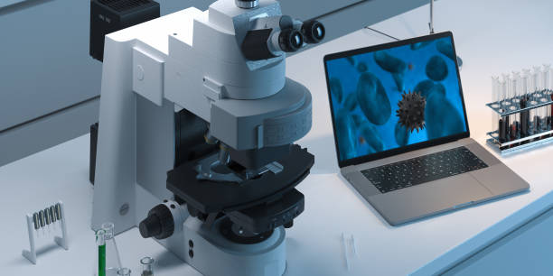 istock Contemporary Microscope realizing laboratory Viruses test and showing results on laptop. 3d rendering 1185034321