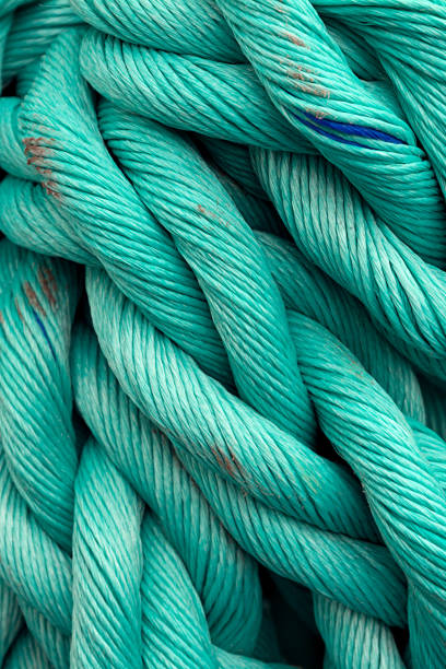istock Nautical background. Old blue frayed ship rope closeup. 1185036749