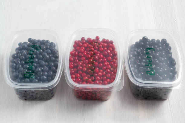 istock Berries laid out in containers and prepared for freezing and storage 1185037659
