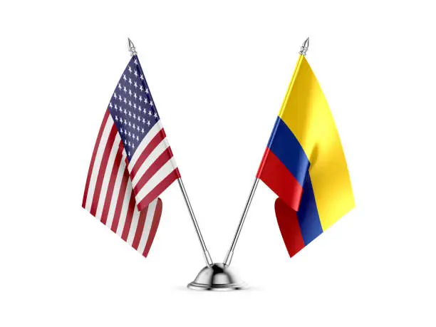Photo of Desk flags, United States  America  and Colombia, isolated on white background. 3d image