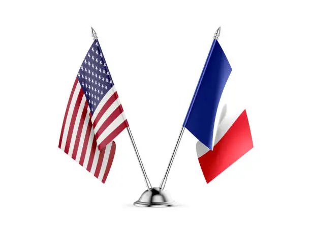 Photo of Desk flags, United States  America  and France, isolated on white background. 3d image