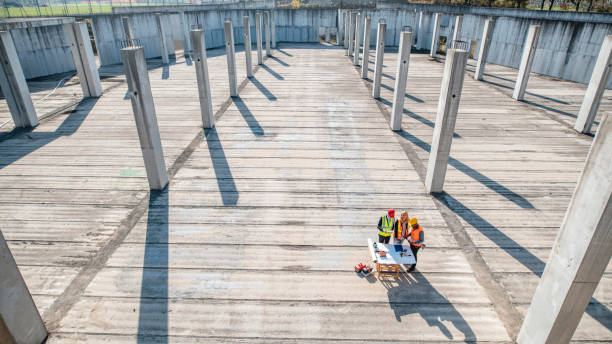 istock High Angle View of Project Partners Meeting with Foreman 1185046288