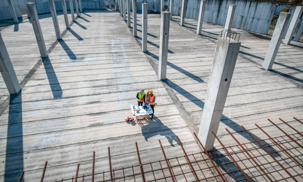 istock Construction Team Meeting Amidst Steel and Concrete 1185046291
