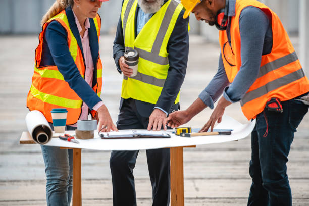 istock Male and Female Team of Developers at Construction Site 1185046317