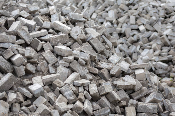 istock Pile of disassembled gray pavement bricks with selective focus 1185048105