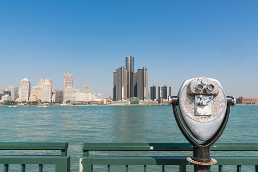 Skyline of Detroit, Michigan across the Detroit River with binocular viewer