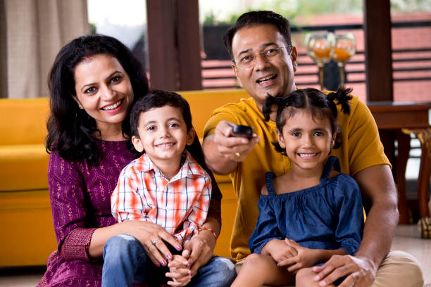istock Family watching TV 1185049498