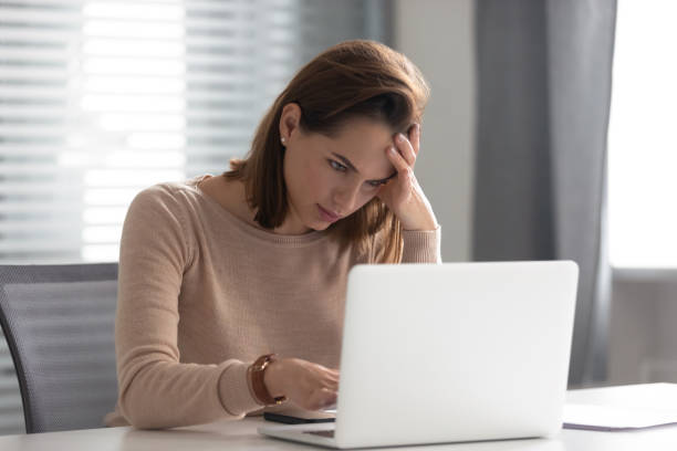 istock Stressed upset young business woman use laptop doing difficult task 1185049593