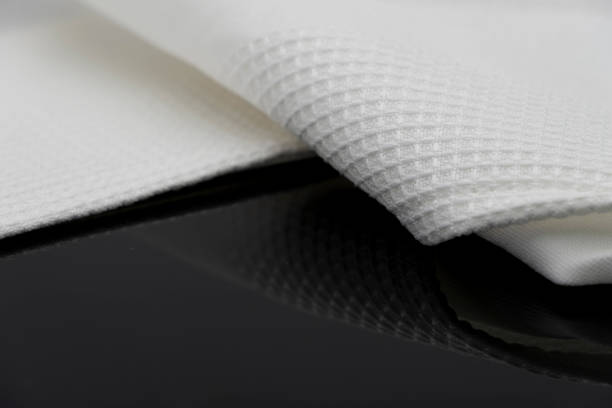 istock Macro shot texture pattern of folded white towel kitchen fabric 1185050985