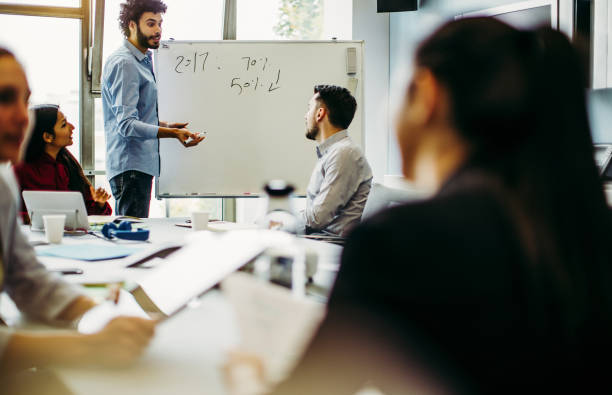 istock Business people discussing in the board room 1185054417