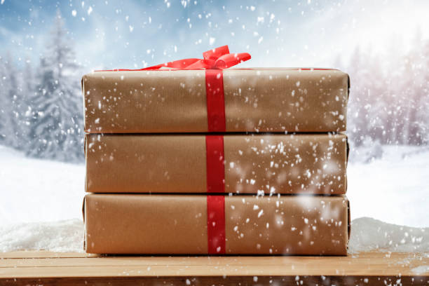 istock Christmas presents with winter background. 1185054547