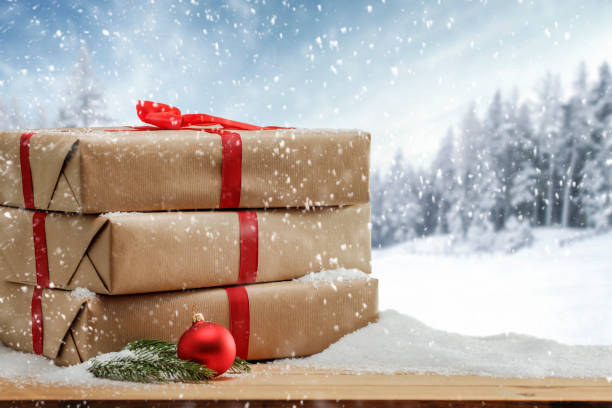 istock Christmas presents with winter background. 1185054583